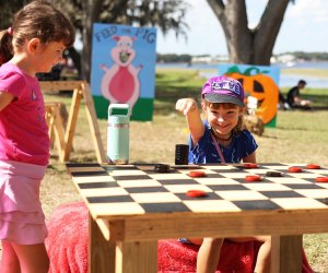 Pig on the Pond is an annual community event featuring carnival rides, kids zone, BBQ competition, and more. Photo courtesy of the event