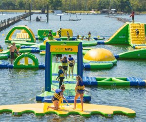 Hit the obstacle course at these inflatable Orlando water parks. Photo courtesy of The Orlando Watersports Complex