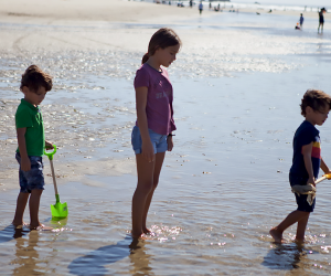 Outdoor Activities in Nature for Kids: kids with shovels on the beach