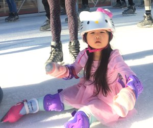 Seasonal Ourdoor Ice Skating Rinks in Los Angeles: Little Girl Sititng on the Ice