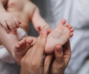 Infant massage can help with development. Photo by Polina Tankilevich via Pexels