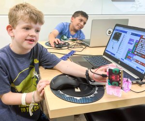Hone their computer skills with the best coding classes for kids in Boston! Photo courtesy of Code Ninjas 