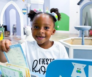 Little girl playing at an indoor play space in Houston. Photo courtesy of Frogs, Snails and Fairy Tales