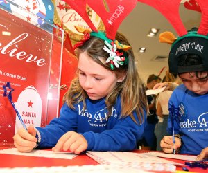kids writing letters at macy's make a wish foundation
