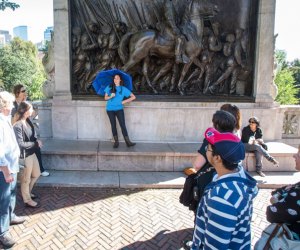 Photo of tour in front of the Massachusetts 54th memorial in Boston.