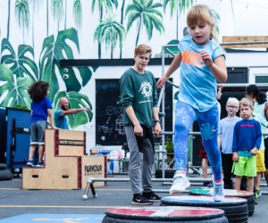 Image of children running a parkour obstacle course in Boston.