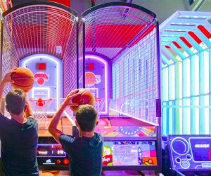 Photo of two kids at a basketball-themed arcade game in CT.
