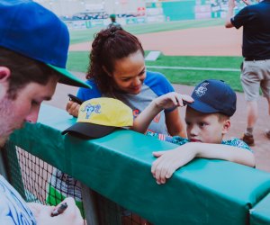Photo of child getting autograph at baseball game in CT.