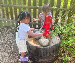 Image of young kids at water pump - Things To Do with Preschoolers