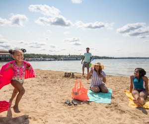 Little girl running on the beach. Photo courtesy of Visit Lake Geneva 