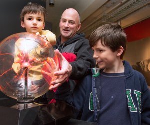 Photo of family with exhibit at MIT Museum.