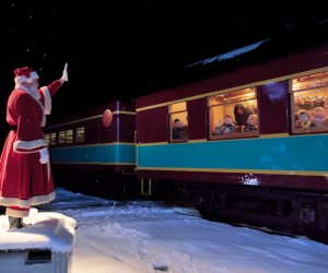 Santa waves to the Polar Express train from his post at the North Pole. Photo courtesy of Cape Cod Central Railroad