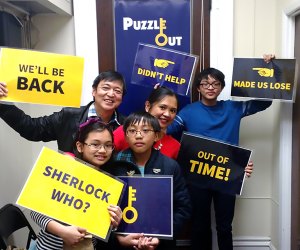 Work together to solve clues at Puzzle Out, one of our favorite family-friendly escape rooms in New Jersey. 