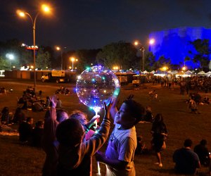 Things to do in NYC on Father's Day: Kids with giant bubbles at the Queens Night Market