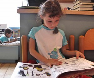 Little girl reading a book