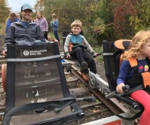 Settle into the reciled seats of a rail bike for a bike riding adventure with Revolution Rail Co. 