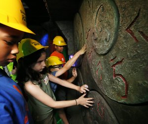Kids embark on a quest at Ripley's Relic in Times Square. Photo by Stuart Ramson/AP Images