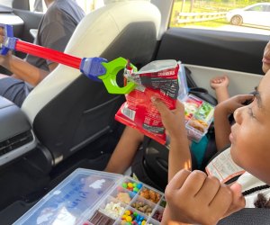 kids using a grabber in the car