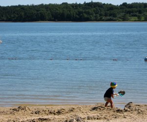 boy in the sand at Round Valley Reservoir Swimming Lakes in New Jersey You Need To Discover