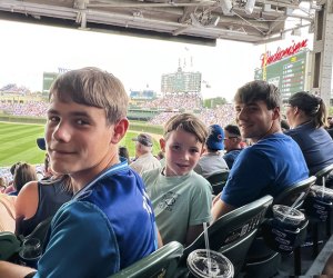 Chicago Cubs fans at Wrigley Field checking of things on their Chicago summer bucket list