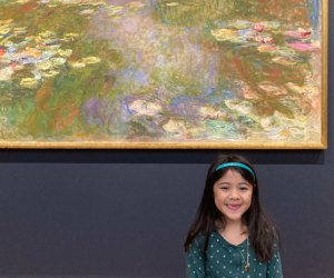 little girl standing in front of a Monet painting at the Institute of Art Chicago