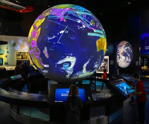 Our kids couldn't get enough of the interactive globe in the One World Connected exhibit. Photo by author Lisa Warden