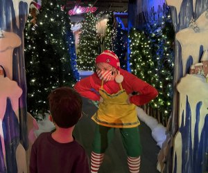 elf greeting kid at Macy's santaland
