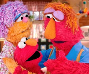 Elmo and his parents on Sesame Street. Image courtesy of PBS 