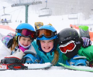 Happy kids take a break in the snow at Seven Springs Mountain Resort. Photo courtesy of Seven Springs