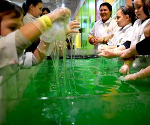 The Slime Factory experience includes time to play in a giant vat of green slime!