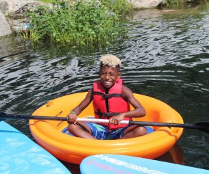  Spring Lake Day Camp has a 5-acre lake for boating, fishing, and water slides. Photo courtesy of the camp