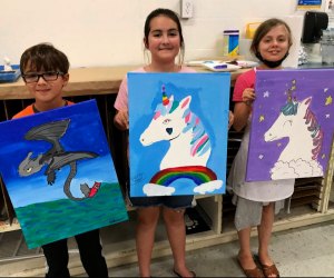 Kids display their artworks from class. Photo courtesy of Sugar Land Art Gallery.