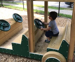 Little ones can take the wheel(s) of the wooden car at Sunset Park.