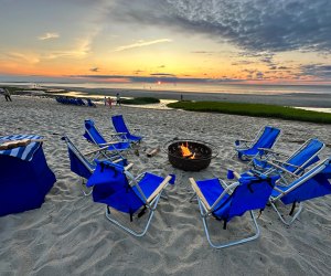 Enjoy s'mores at a fire pit on the private beach as the sun sets!