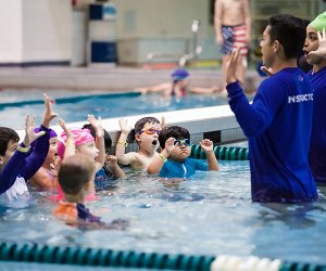 Kids can jump right into learning with swim lessons at Asphalt Green's two locations. Photo courtesy of the venue