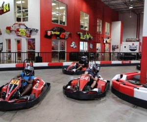 kids drive at an indoor grand prix