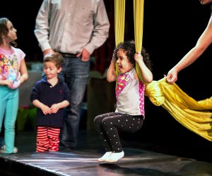 Girl on stage swinging