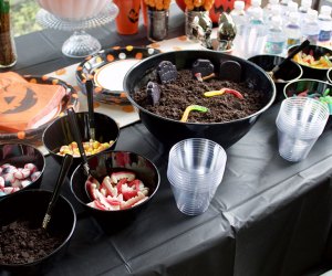 Halloween Party Game Ideas for Tweens and Teens table full of Halloween candy