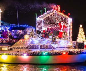 See brightly lit boats pass the Wharf at the District's Holiday Boat Parade. Photo courtesy of Wharf DC