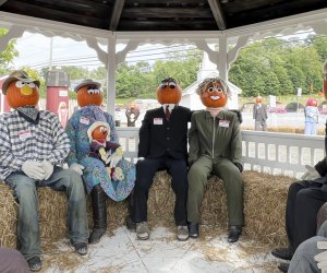 Image of pumpkin-people gathered in a gazebo at Pumpkintown USA.