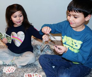 Kids play card games together.