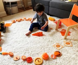 Play easy games, like "Find the orange toys!"
