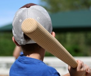 Swing for the fences at summer sports camps. Photo courtesy of Canva