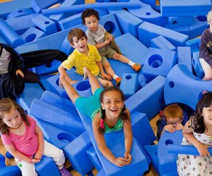 kids playing in blue foam pit