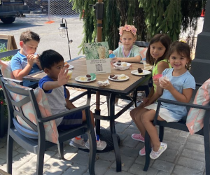 Kids gather around a table at The Compound Coffee Co. in Verona, New Jersey