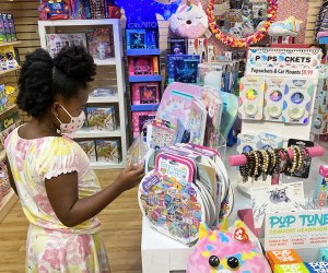 Girl peruses the toys at Learning Express in Verona, New Jersey