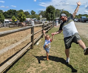 Visiting Alstede Farms with kids child and parent on the farm