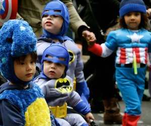 Superheros unite for an evening of trick-or-treat fun in Greenwich Village