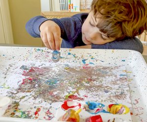 Dip a dreidel in some paint and spin it to create a beautiful piece of art. 
