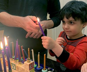 The lighting of the menorah candles is an important job for kids! 